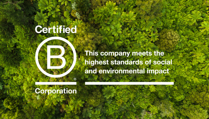 B corp logo explaining how KCare meets high environmental and social standards on a green tree background.